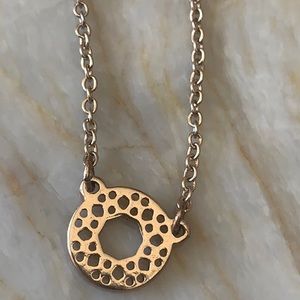 Necklace with a circle designed charm